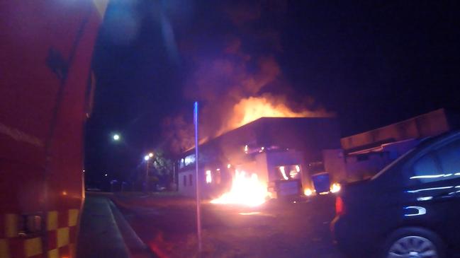 An automotive workshop and several vehicles were destroyed in a suspicious fire at Sefton. Picture: Fire and Rescue NSW