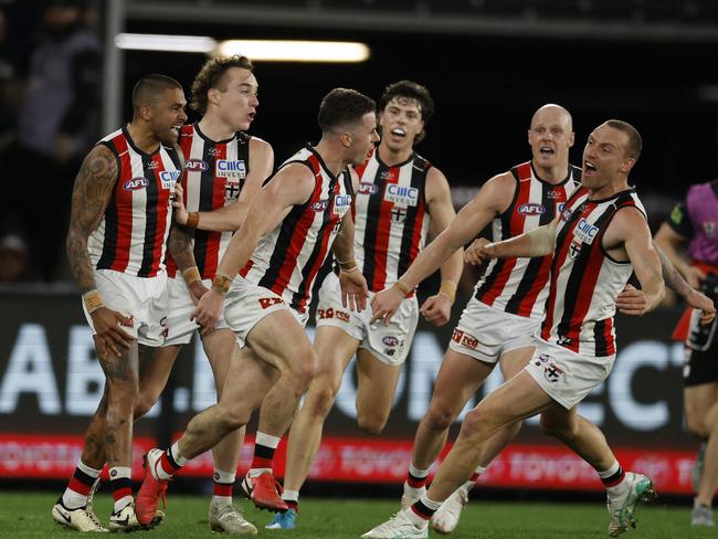 Jack Higgins of the Saints celebrates the match winner in the dying seconds with teammates. Picture: Michael Klein