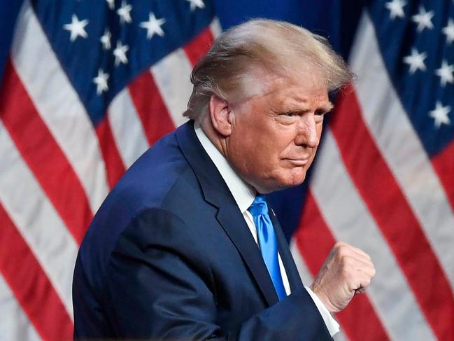 US President Donald Trump pumps his fist after speaking during the first day of the Republican National Convention on August 24, 2020, in Charlotte, North Carolina. - President Donald Trump went into battle for a second term Monday with his nomination at a Republican convention where he will draw on all his showman's instincts to try and change the narrative in an election he is currently set to lose. (Photo by David T. FOSTER III / POOL / AFP)