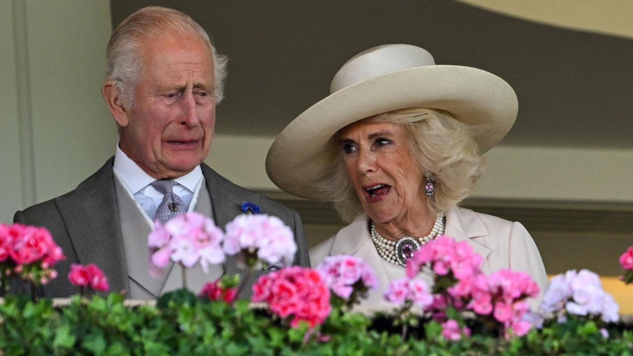 Britain's King Charles III (L) and Britain's Queen Camilla react as they watch the horse races on the fifth day of the Royal Ascot in June 2024. Photo: AFP