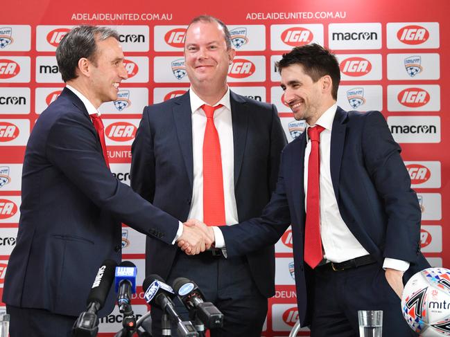 Adelaide United chairman Piet van der Pol, Aurelio Vidmar (left) and Nathan Kosmina (right) during a press conference at Coopers Stadiium in Hindmarsh, Adelaide, Wednesday, September 12, 2018. (AAP Image/David Mariuz) NO ARCHIVING