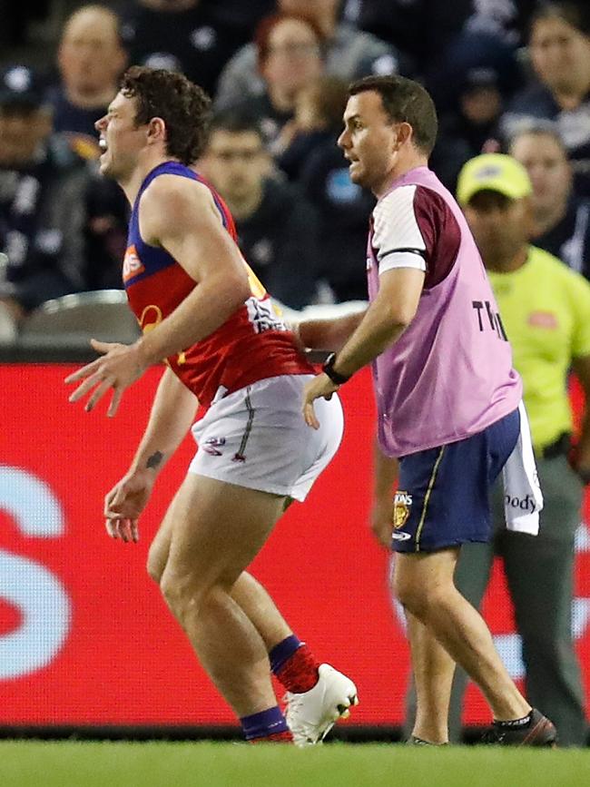 Lachie Neale hobbles away after injuring his ankle.