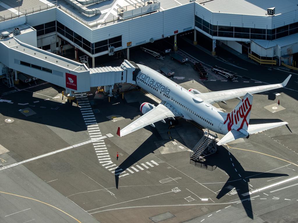 Grounded Virgin Australia aircraft at Sydney Airport on Wednesday, a day after the airline went into voluntary administration. Picture: Cameron Spencer/Getty Images