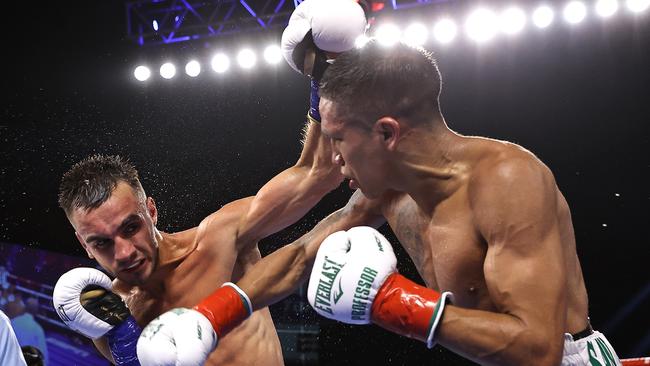 CATOOSA, OKLAHOMA - AUGUST 14: Andrew Moloney (L) and Joshua Franco (R) exchange punches during their fight for the WBA super flyweight championship at Hard Rock Hotel &amp; Casino Tulsa on August 14, 2021 in Catoosa, Oklahoma. (Photo by Mikey Williams/Top Rank Inc via Getty Images)