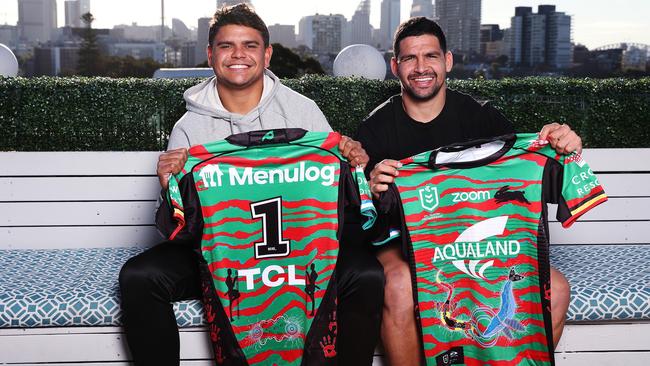 NRL stars Latrell Mitchell, left, and Cody Walker with South Sydney’s Indigenous Round jersey. Picture: Brett Costello