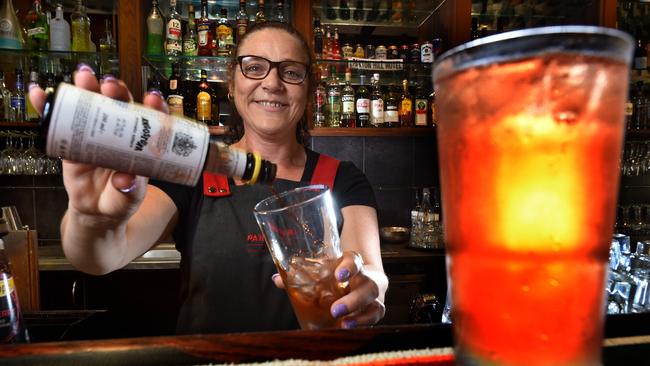 Panton Hill Hotel duty manager Lynda Hunter pours a lemon, lime and bitters. Picture: Tony Gough