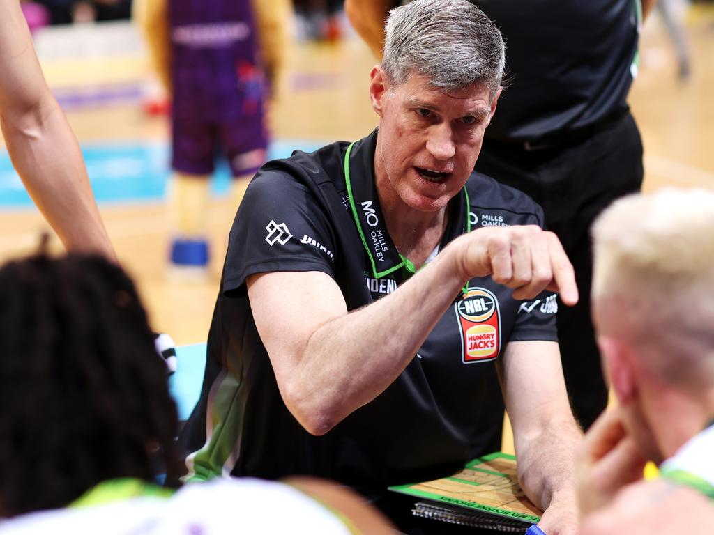 Mike Kelly, head coach of the Phoenix, speaks to his team during a time out in the round 10 NBL match against the Sydney Kings. Photo: Mark Kolbe/Getty Images.