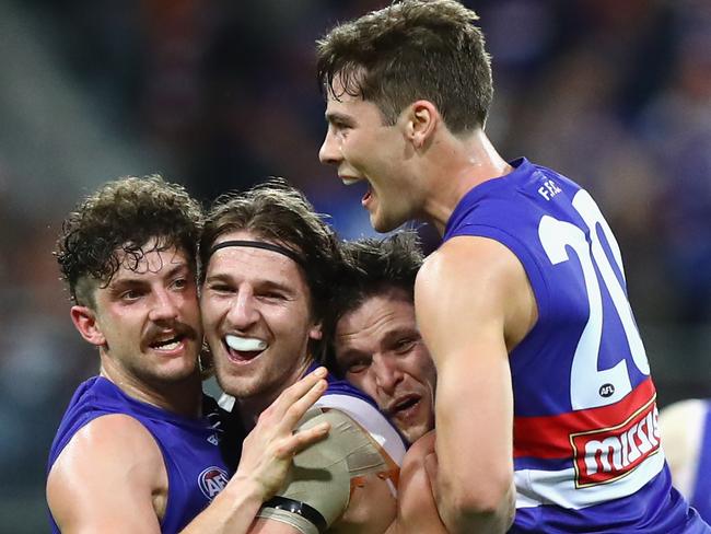 Tom Liberatore, Marcus Bontempelli, Dale Morris and Josh Dunkley celebrate victory over GWS. (Photo by Ryan Pierse/Getty Images)