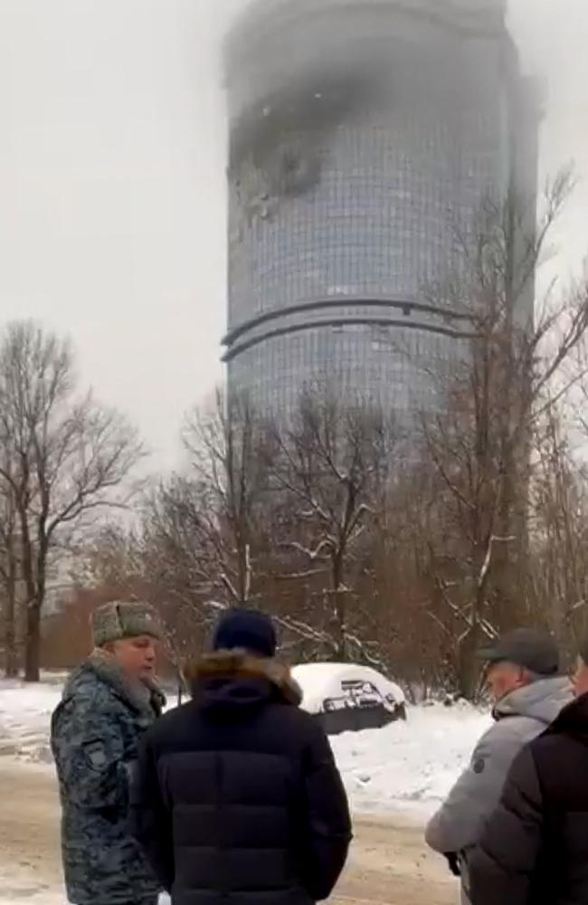 Local officials stand in front of a damaged residential building following a drone attack in Kazan, amid the ongoing Russian-Ukrainian conflict. Picture: Telegram/ AFP.