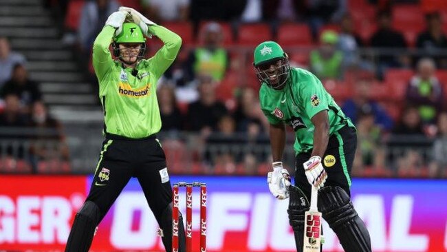 Sam Billings and Andre Russell react after the ball hit the stumps but didn’t dislodge the bails. Picture: Mark Kolbe / Cricket Australia via Getty Images