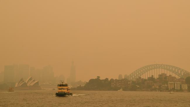 The Black Summer saw a blanket of smoke haze descend on the Harbour, enveloping the Bridge and Opera House with it. Picture: Joel Carrett/AAP