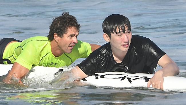 Currimbin coach ackson Maynard (left) in action during the rescue.