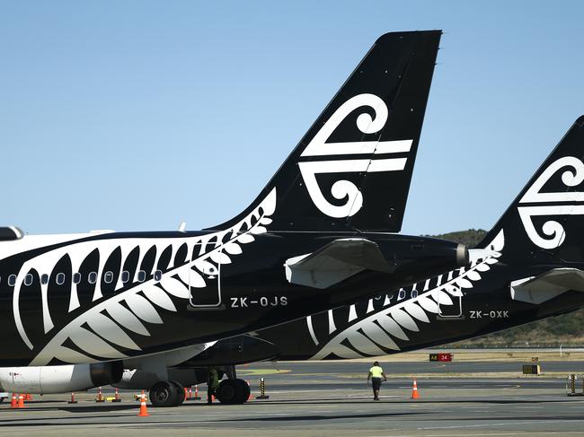 WELLINGTON, NEW ZEALAND - MARCH 16: The tails of Air New Zealand planes at Wellington Airport on March 16, 2020 in Wellington, New Zealand. Strict new border measures to contain the spread of COVID-19 came into effect at 1am on Monday, requiring all arrivals into New Zealand to self-isolate for 14 days upon arrival. Those in self-isolation must avoid social gatherings, work, school, child care facilities, university, religious gatherings, aged care and health facilities, prisons, sports gatherings, restaurants, and all public gatherings during the two-week period. New Zealand currently has eight confirmed cases of COVID-19. (Photo by Hagen Hopkins/Getty Images)