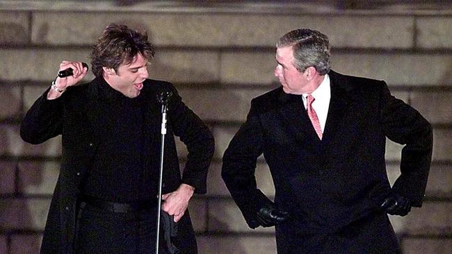 US President-elect George W. Bush dances with pop singer Ricky Martin, during The Inaugural Opening Celebration on the steps of the Lincoln Memorial on 18 January, 2001, in Washington, DC. Picture: AFP