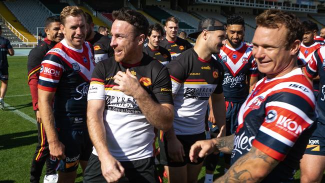 James Maloney chats with former teammates Mitch Aubusson and Jake Friend.