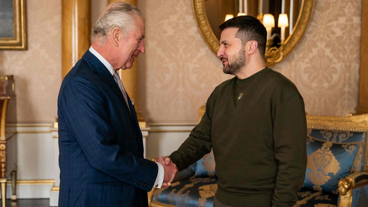 King Charles III shakes hands with Ukraine's President Volodymyr Zelensky at Buckingham Palace. (Photo by Aaron Chown / POOL / AFP)