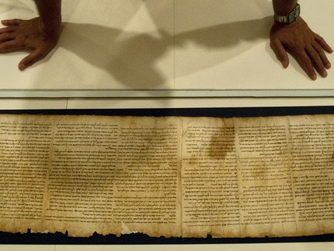 Holy word ... Part of the Isaiah Scroll, one of the Dead Sea Scrolls now held inside the vault of the Shrine of the Book building at the Israel Museum in Jerusalem. Source: AP