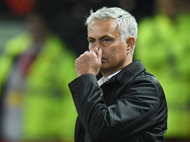 Manchester United's Portuguese manager Jose Mourinho gestures from the touchline after the final whistle in the English Premier League football match between Manchester United and Tottenham Hotspur at Old Trafford in Manchester, north west England, on August 27, 2018. (Photo by Oli SCARFF / AFP) / RESTRICTED TO EDITORIAL USE. No use with unauthorized audio, video, data, fixture lists, club/league logos or 'live' services. Online in-match use limited to 120 images. An additional 40 images may be used in extra time. No video emulation. Social media in-match use limited to 120 images. An additional 40 images may be used in extra time. No use in betting publications, games or single club/league/player publications. /