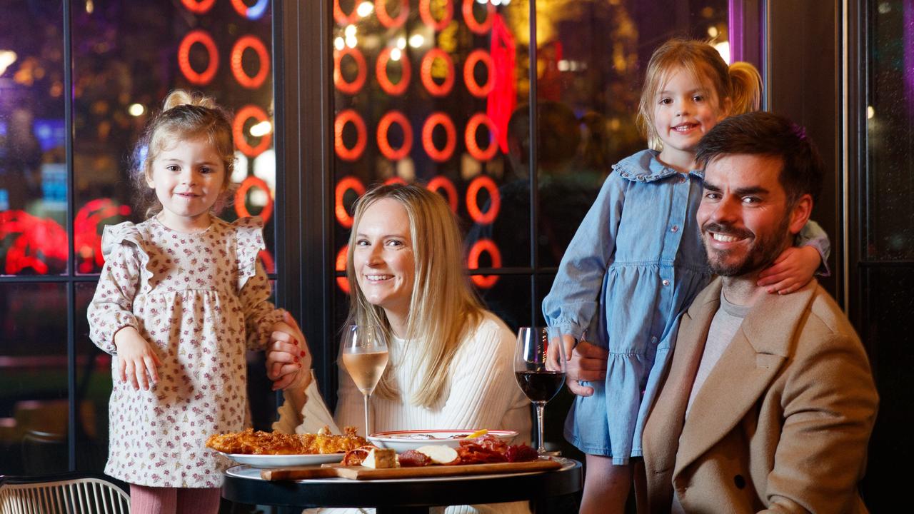 Brooke and Tom Bridges with their children Winnie (left) and Isabel enjoying Lumen at University of Adelaide, as part of Illuminate Adelaide. Picture” Matt Turner