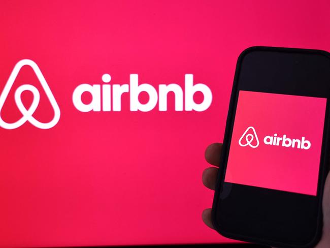 LOS ANGELES, CALIFORNIA - FEBRUARY 13: In this photo illustration, the Airbnb logo is displayed on a computer monitor and cell phone on February 13, 2024 in Los Angeles, California. Airbnb plans to report fourth quarter earnings today after a strong performance last quarter. (Photo Illustration by Mario Tama/Getty Images) (Photo by MARIO TAMA / GETTY IMAGES NORTH AMERICA / Getty Images via AFP)