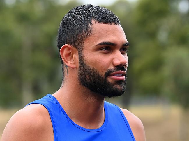 MELBOURNE, AUSTRALIA - FEBRUARY 27: Tarryn Thomas of the Kangaroos walks off the training track with his team mates during a North Melbourne Kangaroos AFL media opportunity at Arden Street Ground on February 27, 2023 in Melbourne, Australia. (Photo by Quinn Rooney/Getty Images)