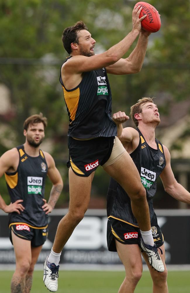 Toby Nankervis flies over David Astbury at Richmond training. Picture: Wayne Ludbey