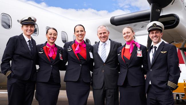 First officer Danita Henderson with cabin crew, Brianna Watkins, Rebecca Holroyd and QantasLink CEO John Gissing, Kim Elvidge and Captain Matthew Hooper at Kingscote Airport on Kangaroo Island. Picture: Matt Loxton