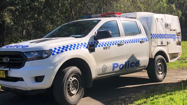 Police take Malcolm Berkeley from the Hilvershum Cres property after he attacked police and had to be tasered. Picture: Jim O'Rourke