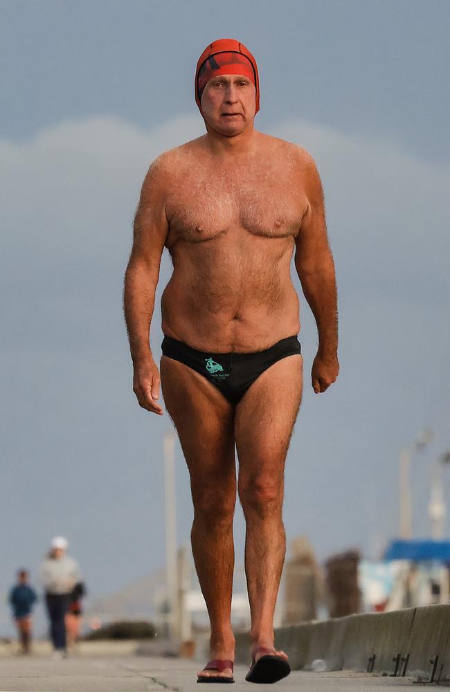 Clifford Hayes makes his way back along the pier after a swim. Picture: Ian Currie