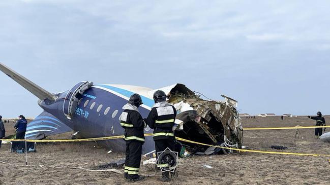 Emergency specialists work at the crash site in Kazakhstan. Picture: AFP