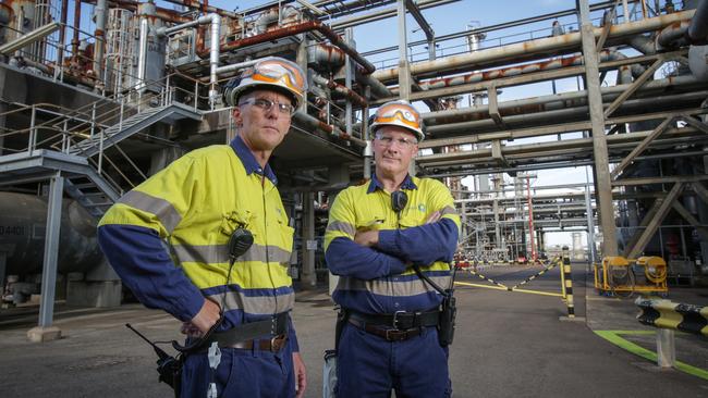 Workers at Qenos’ Sydney chemicals manufacturing plant.