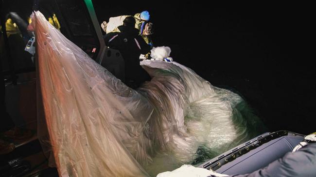 US sailors assigned to Explosive Ordnance Disposal Group 2 recover a high-altitude surveillance balloon off the coast of Myrtle Beach, South Carolina.