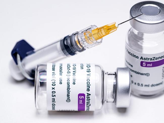 (FILES) In this file photo taken on March 11, 2021 This picture shows vials of the AstraZeneca Covid-19 vaccine and a syringe in Paris on March 11, 2021. - President Emmanuel Macron said on March 15, 2021, that France was suspending use of the AstraZeneca Covid-19 vaccine, pending a review of its safety by the European Medicines Agency (EMA). (Photo by JOEL SAGET / AFP)