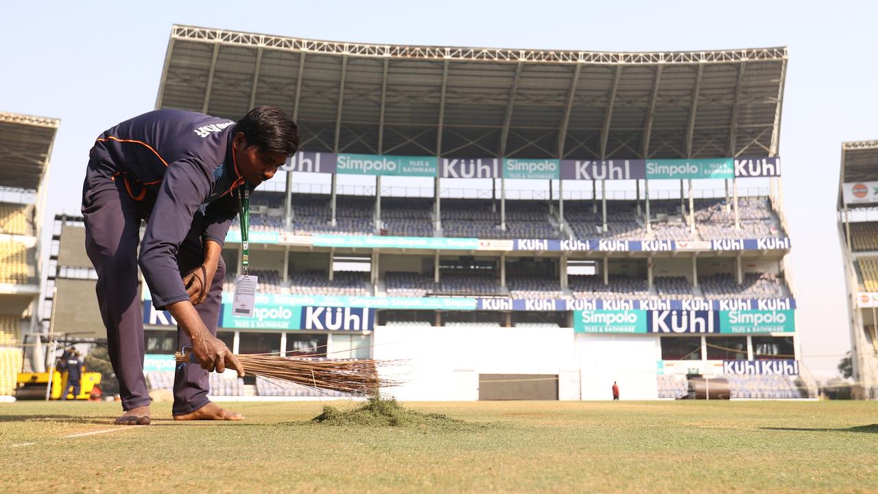 Ground keepers work on the pitch during a training session at Vidarbha Cricket Association Ground in Nagpur.