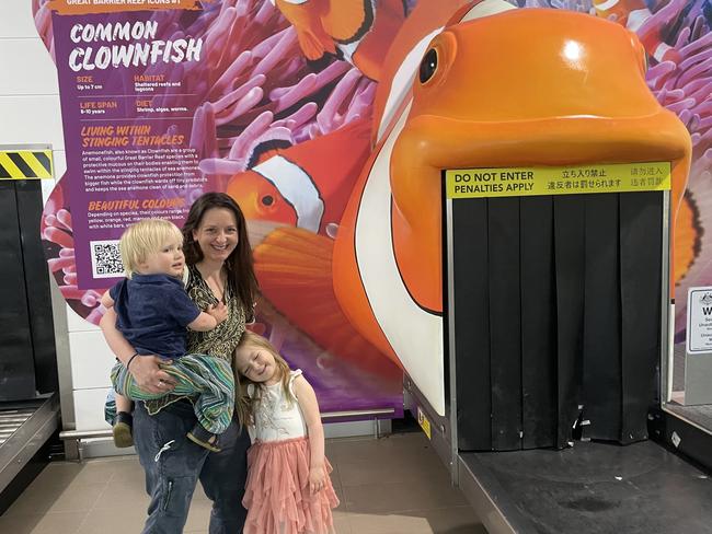 Simone Hutchinson with her son Hamish (two-years-old) and her daughter Lilly (four-years-old) from South Australia. Ms Hutchinson hought the new artwork at the Cairns Airport  was great for the children.