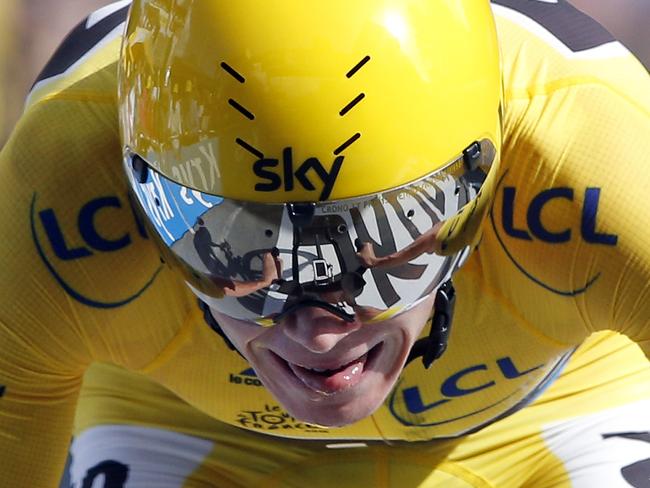 Britain's Chris Froome, wearing the overall leader's yellow jersey crosses the finish line to win the eighteenth stage of the Tour de France cycling race, an individual time trial over 17 kilometers (10.6 miles) with start in Sallanches and finish in Megeve, France, Thursday, July 21, 2016. (AP Photo/Christophe Ena)