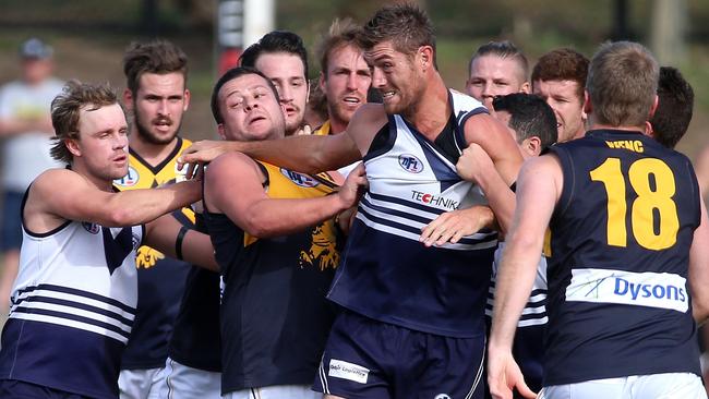 Players from both Whittlesea and Bundoora were locked in a wrestle at quarter-time. Picture: Mark Dadswell