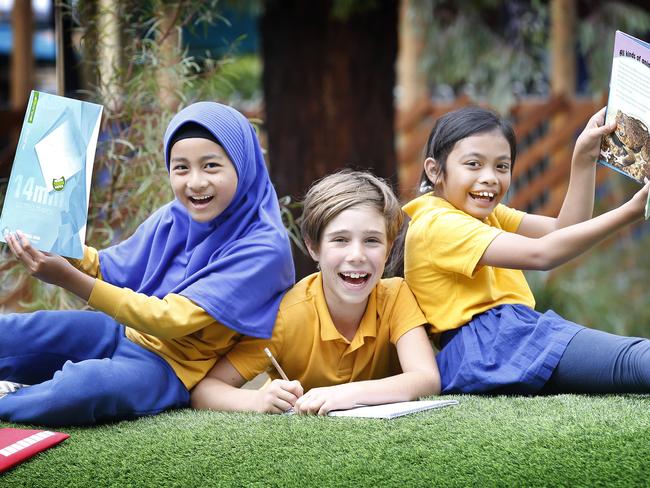 Four or five grade 4 students celebrate their great results in NAPLAN 2019. The national report is out showing Victoria's primary school kids dominate. Children from language backgrounds other than English also dominate, showing the best results in every field except reading. Multicultural Moreland Primary School year 4 students Nafisa 9, Orpheus 9 and Serena 8.     Picture: David Caird