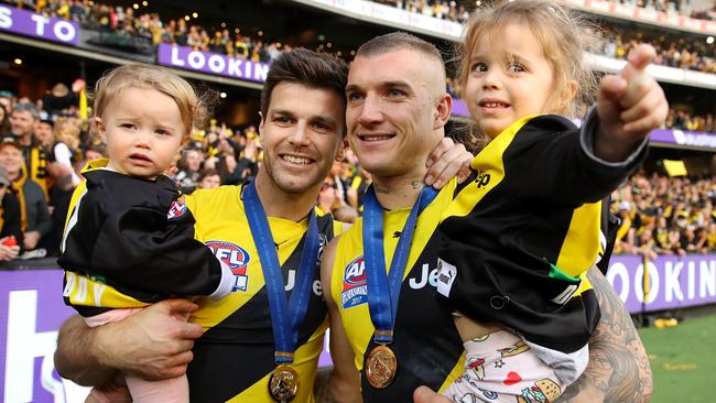 Trent Cotchin and Dustin Martin with Cotchin’s daughters after winning the 2017 AFL Grand Final. Picture: Getty Images