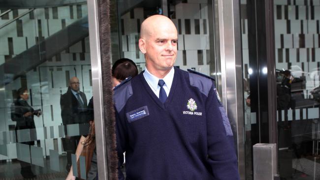 Victoria Police Chief Commissioner Simon Overland leaves a news conference yesterday at which he defended his use of information from a police phone tap. Picture: AAP