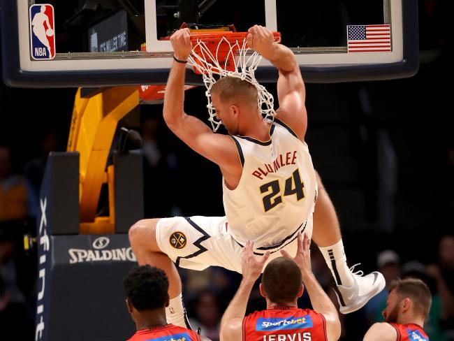 Mason Plumlee dunks over Perth's Terrico White. Picture: Getty