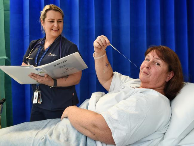 Patient Leeanne Whitfield was given chewing gum after surgery at Royal Melbourne Hospital as part of a medical trial to determine if it can help them overcome the nausea many experience after an operation. Associate Nurse Unit Manager Christie Golding looks on. Picture: Tony Gough