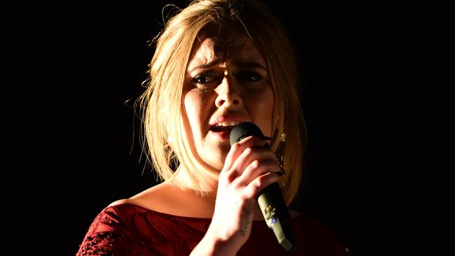 Adele performs onstage during the 58th Annual Grammy music Awards in Los Angeles February 15, 2016. AFP PHOTO/ ROBYN BECK