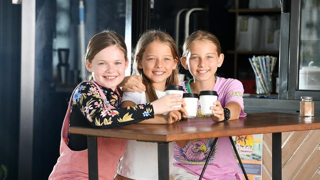 Maia Packer, 10, Grace Pepper, 8, and Gabby Pepper, 10, enjoying a hot chocolate together. Picture: Shae Beplate.