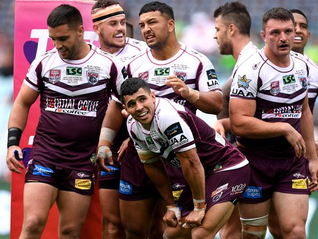 Jamal Fogarty (centre) celebrates with Burleigh teammates after scoring a try during the NRL State Championship against Newtown earlier this month. Picture: AAP Image/Dan Himbrechts