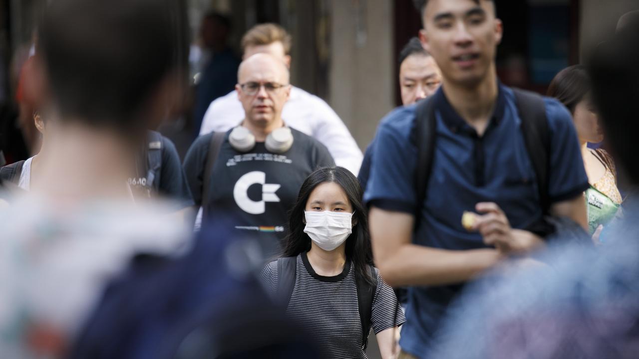 Mask are commonly now being worn around the Sydneys CBD due to the fear of the Coronavirus. Photo: Tim Pascoe