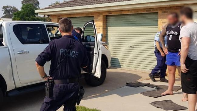 The arrest of Mr Bowtell after police raids last year. Picture: NSW Police