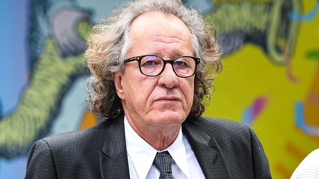 ***RETRANSMITTING FOR ALL IMAGES WITH OBJECT NAME*** GEOFFREY RUSH COURT***  CHANGING TO FEDERAL COURT***  Australian actor Geoffrey Rush (left) is seen at the Federal Court in Sydney, Wednesday, July 4, 2018. The virtually housebound actor Geoffrey Rush has ventured into Sydney's Federal Court to attend mediation related to his defamation case against the Daily Telegraph. The actor was snapped entering and leaving the court on Wednesday, as was journalist Jonathon Moran. (AAP Image/Brendan Esposito) NO ARCHIVING