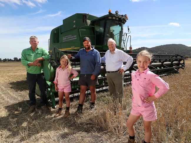 Matthew Richmond  harvesting wheat, 4 generations,  with his uncle Craig Richmond, father Tom Richmond,  87, his daughters Peyton & Ava, both 7 years old,   Little River,   Picture Yuri Kouzmin