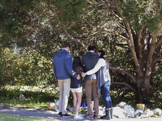 People arrive to pay tribute at the house where two kids were murdered by their father, in West Pennant Hills. Picture: Jenny Evans.